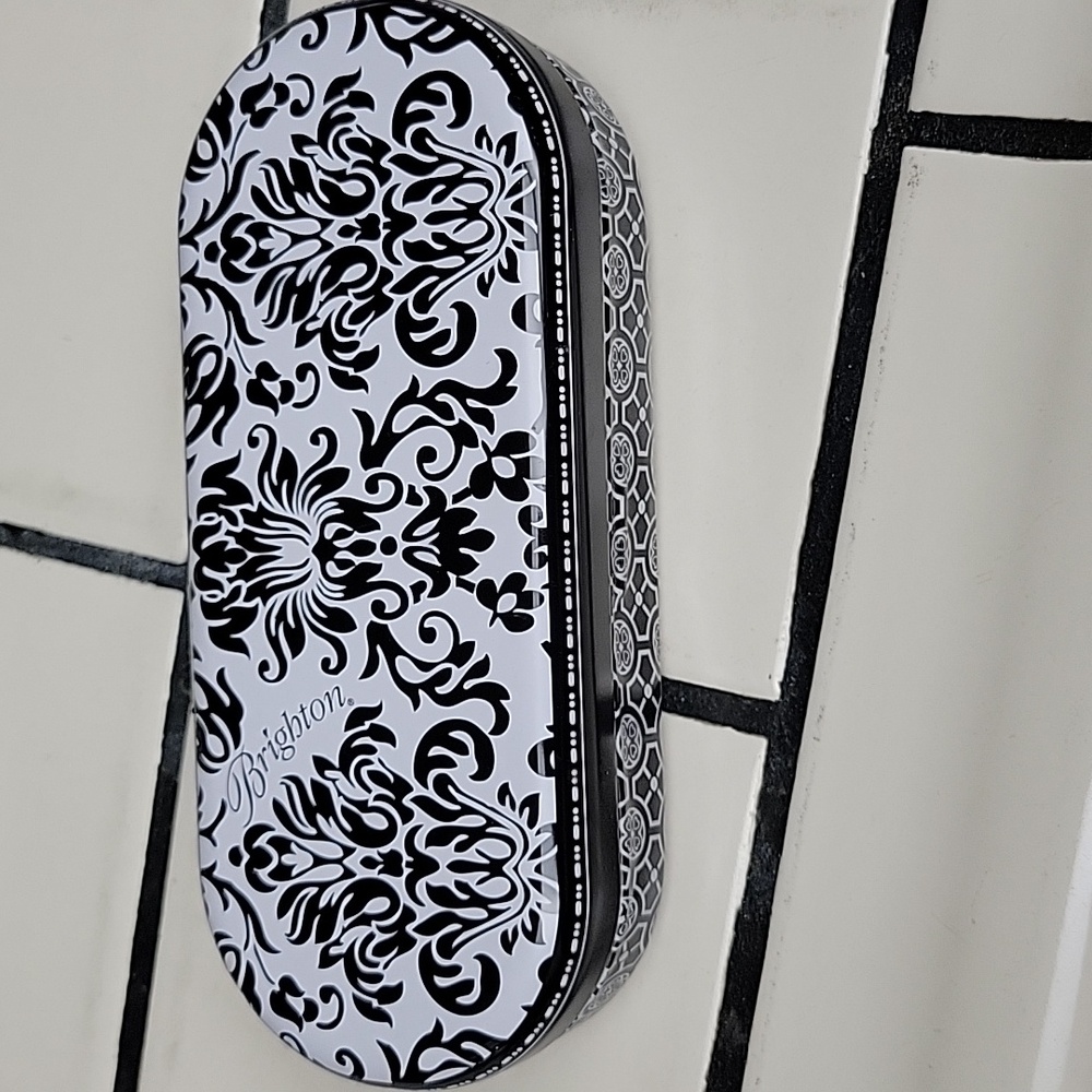 Metal Brighton glasses case.